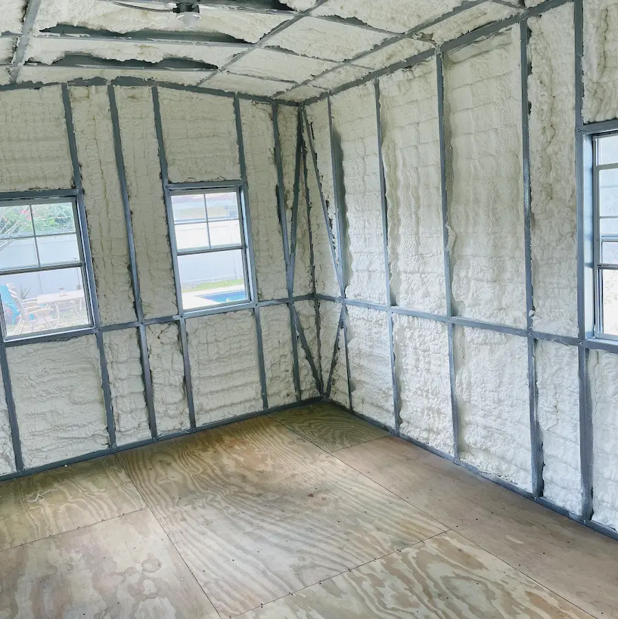 Closed-cell spray foam insulation applied to wall cavities in a residential project in Brandon